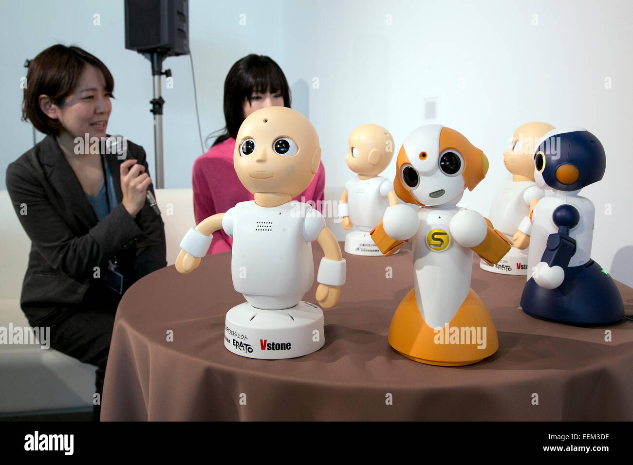 Tokyo, Japan. 20th Jan, 2015.  A woman speaks with CommU and Sota robots during a press conference at the National Museum of Emerging Science and Innovation Miraikan. The robots CommU and Sota can interact with humans and other robots in normal life conversation. According to profesor Ishiguro the robots can to speak, answer and ask multiple questions in Japanese and English, which can help users to learn other languages. Credit:  Rodrigo Reyes Marin/AFLO/Alamy Live News Stock Photo