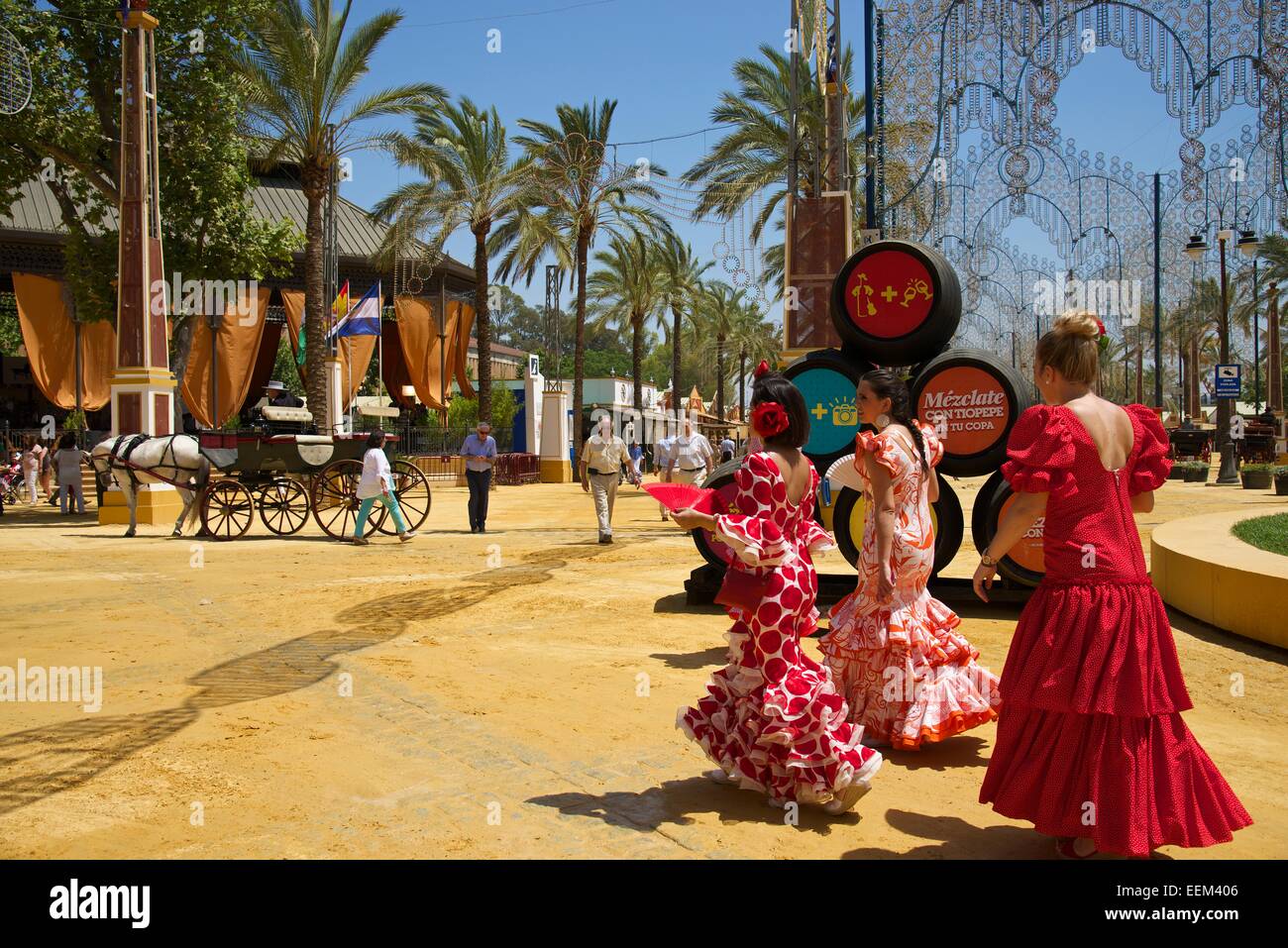 Women in flamenco dresses at the Feria del Caballo, Jerez de la Frontera, Andalusia, Spain Stock Photo