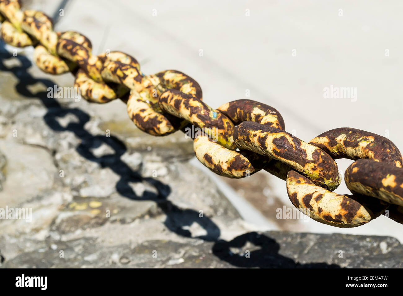 Rusty metal chain with torus shape links Stock Photo
