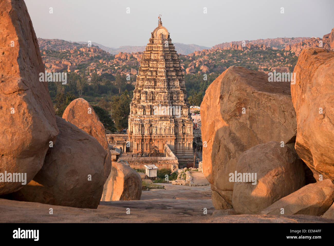 Granite rocks and Gopuram of the Virupaksha Temple, Hampi, Karnataka, India Stock Photo