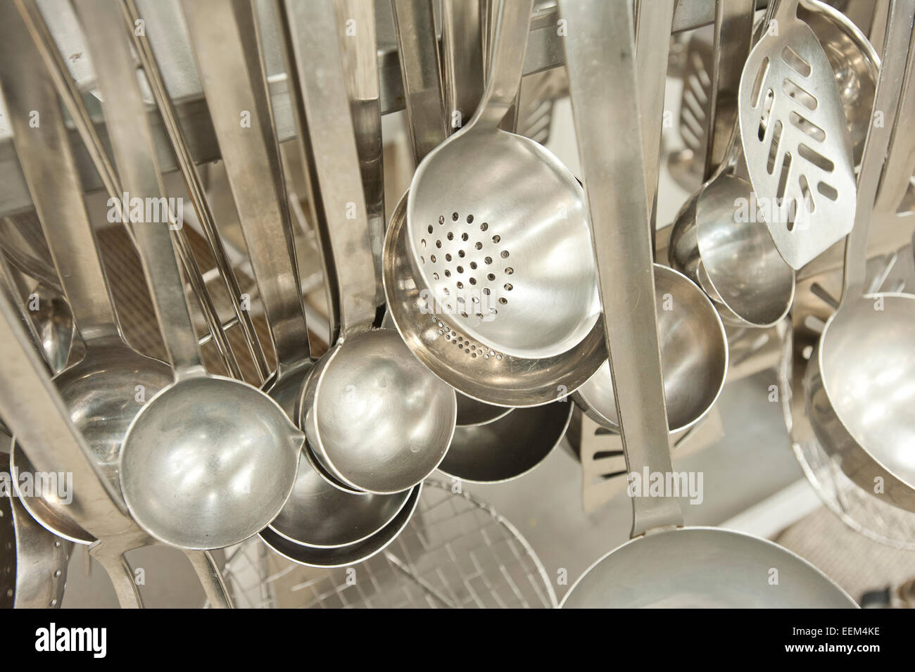 Ladles, slotted spoon, kitchen tools in an industrial kitchen, Germany Stock Photo