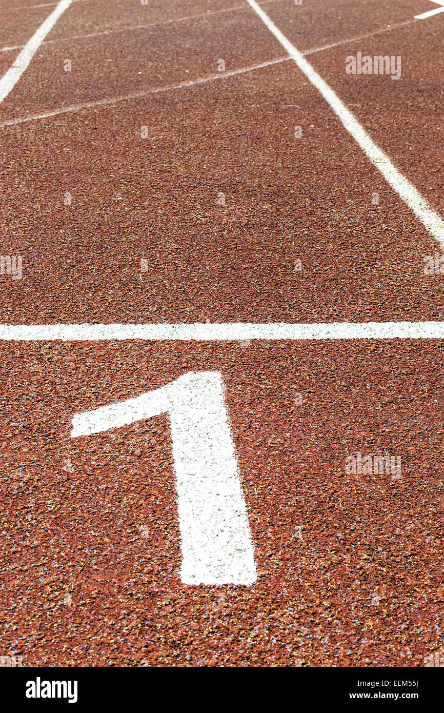 Number one , indicating the first lane on an outdoor running track and being first Stock Photo