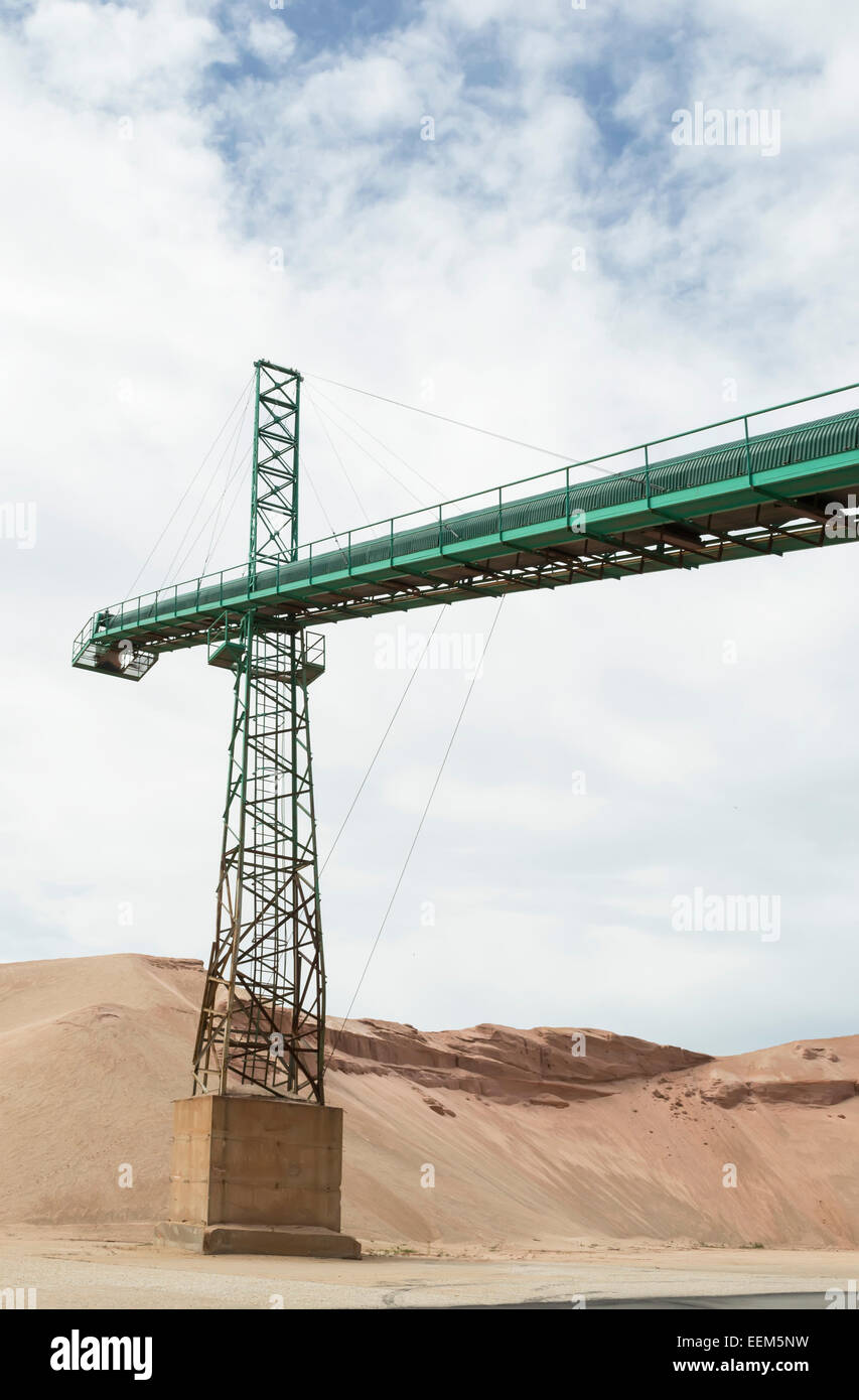 Conveyor belt crane as part of an ore processing facility Stock Photo