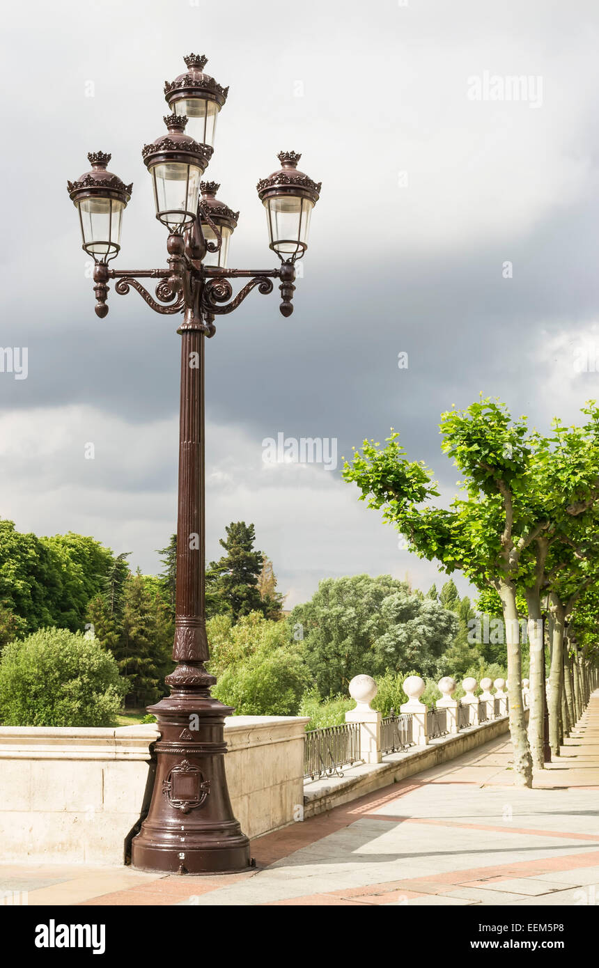 Elegant street lighting pole with five arms and lamps decorated in classic style Stock Photo