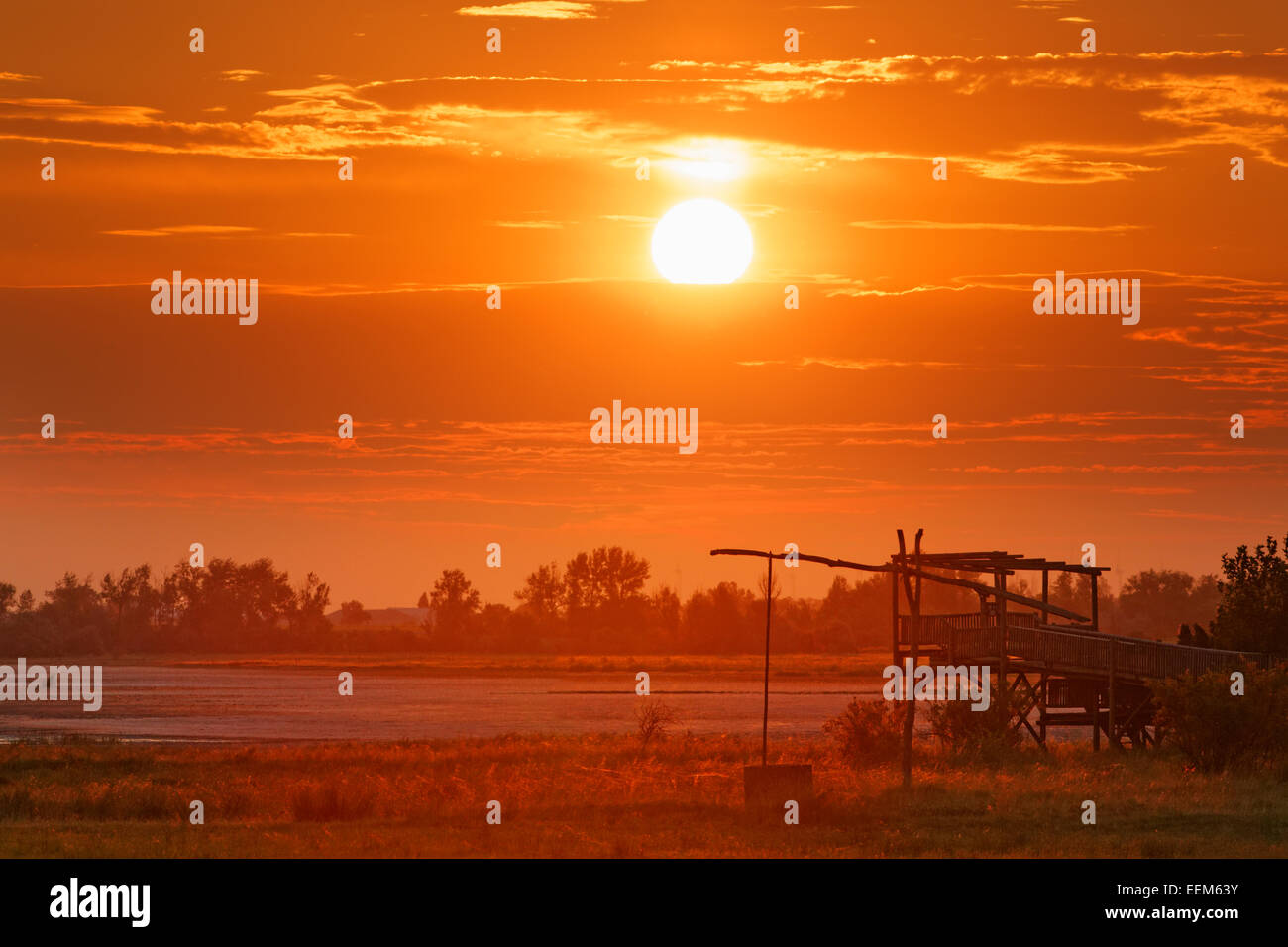 Drawing well at sunrise, Lake Neusiedl national park, Seewinkel, Illmitz, Northern Burgenland, Burgenland, Austria Stock Photo