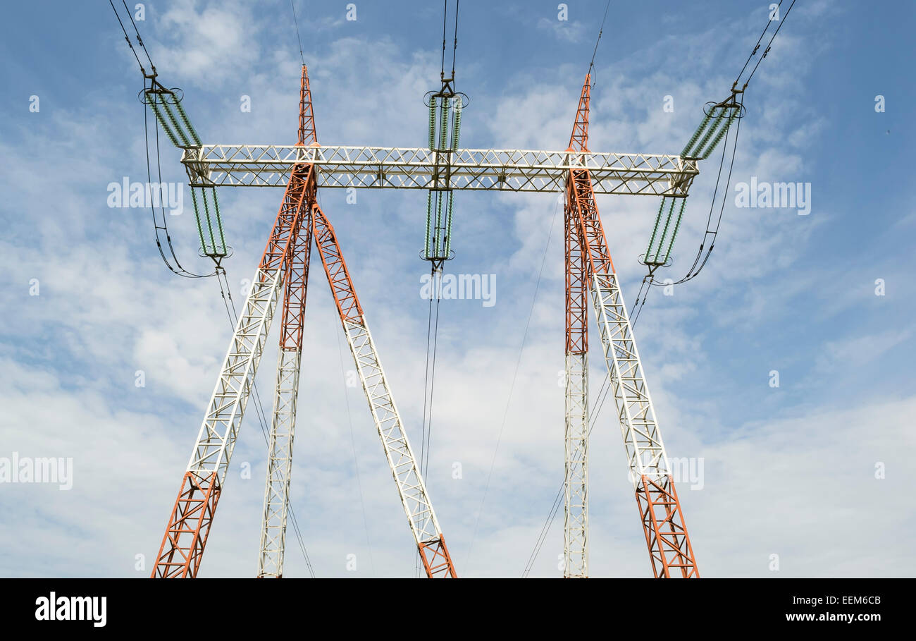 High voltage power line pole as part of a wide area electrical energy distribution grid, seen from below Stock Photo