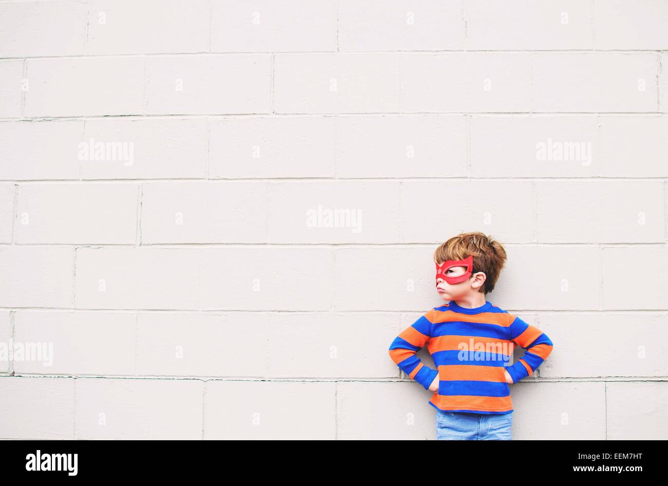 Young boy (2-3) wearing super hero mask Stock Photo