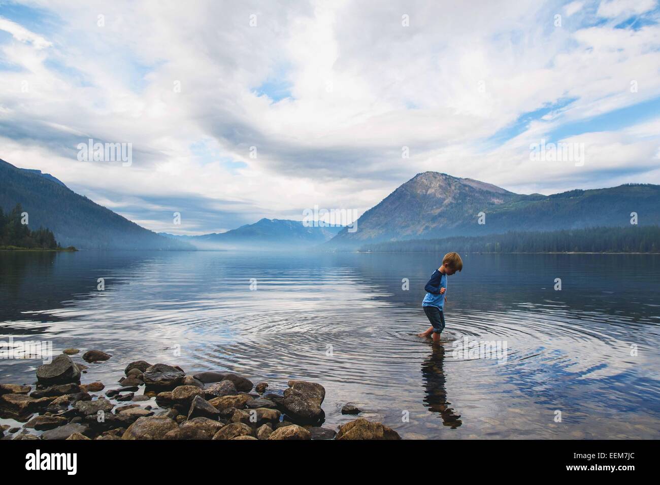 Boy wading in a lake, USA Stock Photo