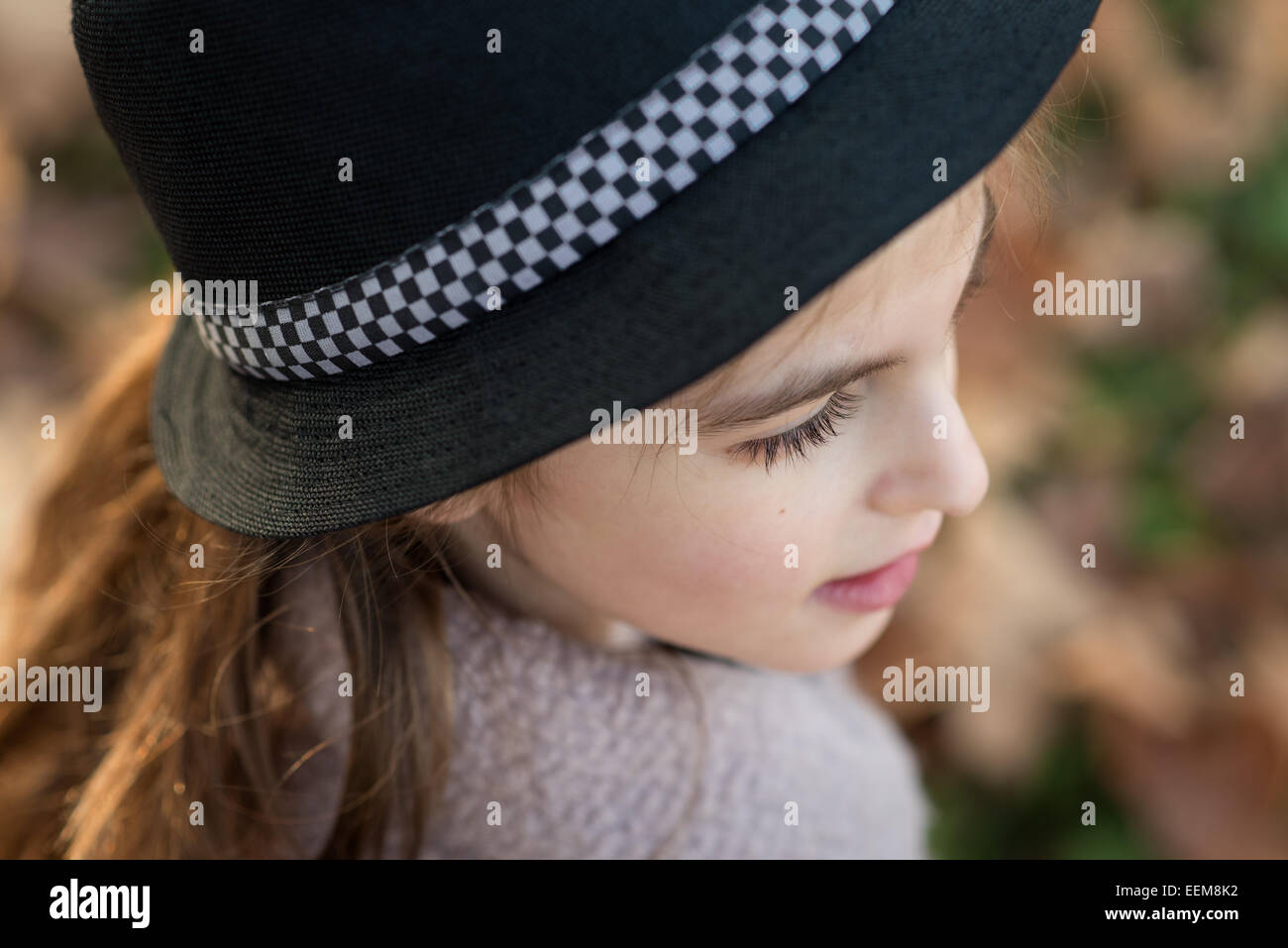 Cute girl (8-9) in hat Stock Photo
