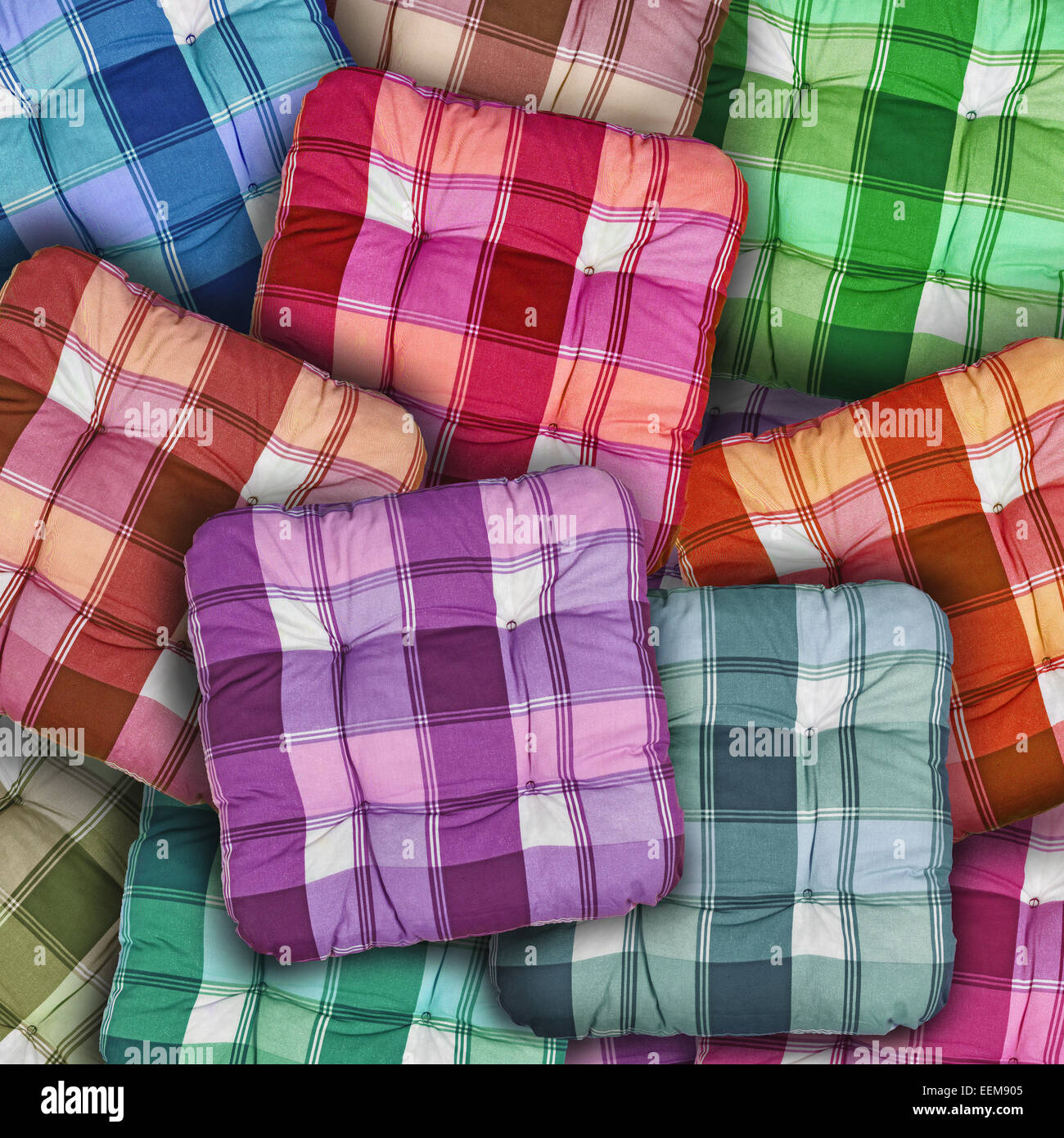 Plaid Colorful Cushions piled as home interior decoration background Stock Photo
