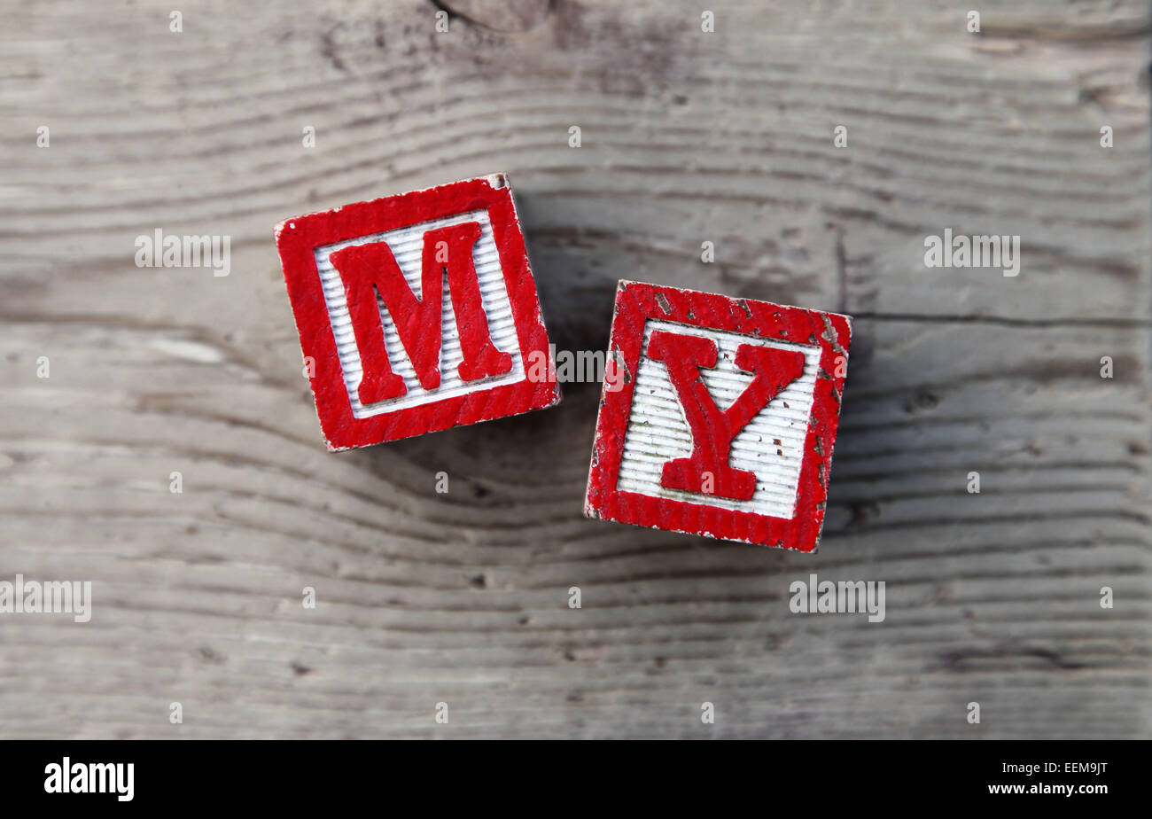 It's a photo top view of wood blocks or wood cubes combined together to create the word MY Stock Photo