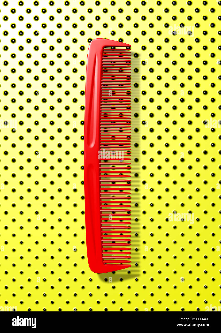 Close up of red comb on polka dot background Stock Photo