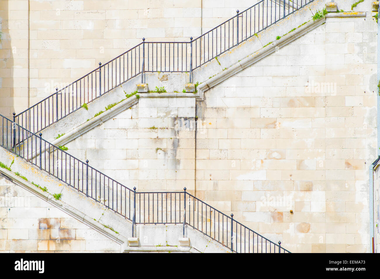 Banister and staircase on tall building Stock Photo