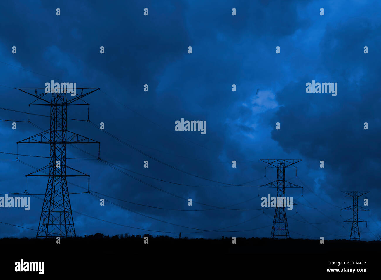 Silhouette of power lines under dark cloudy sky Stock Photo - Alamy