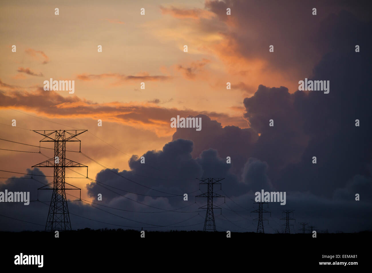 Silhouette of power lines under cloudy sky Stock Photo - Alamy