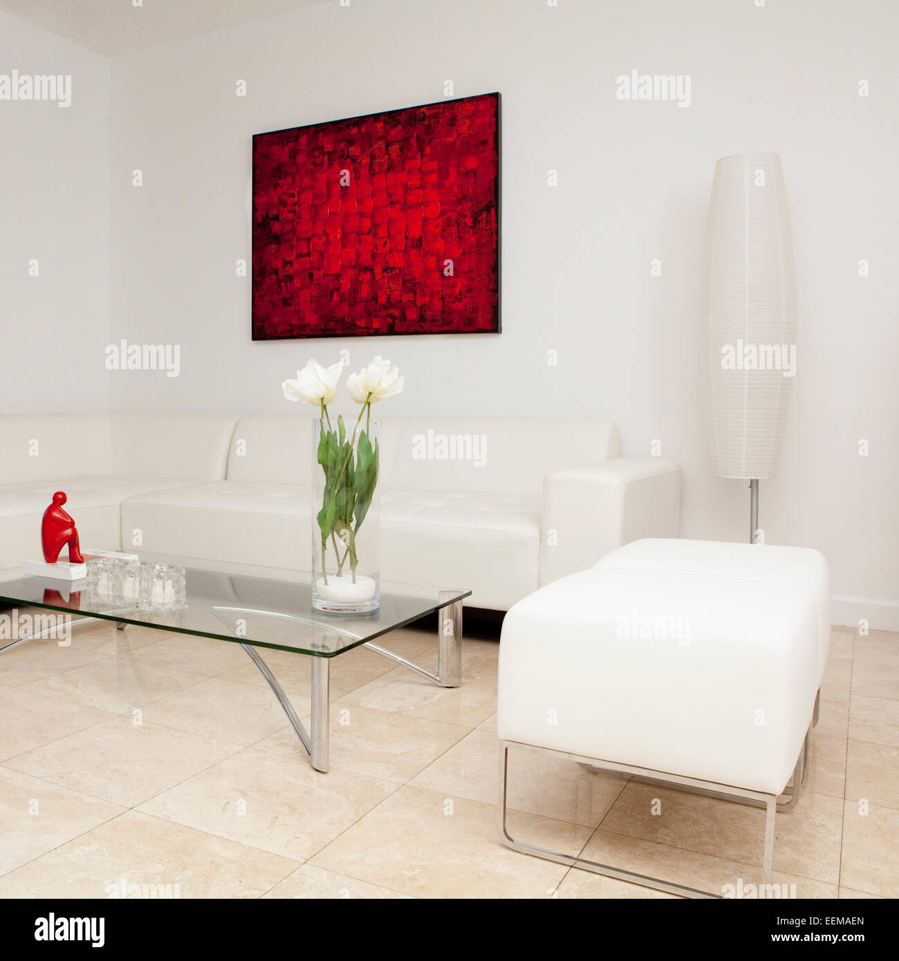 Coffee table, sofas and wall art in modern living room Stock Photo - Alamy