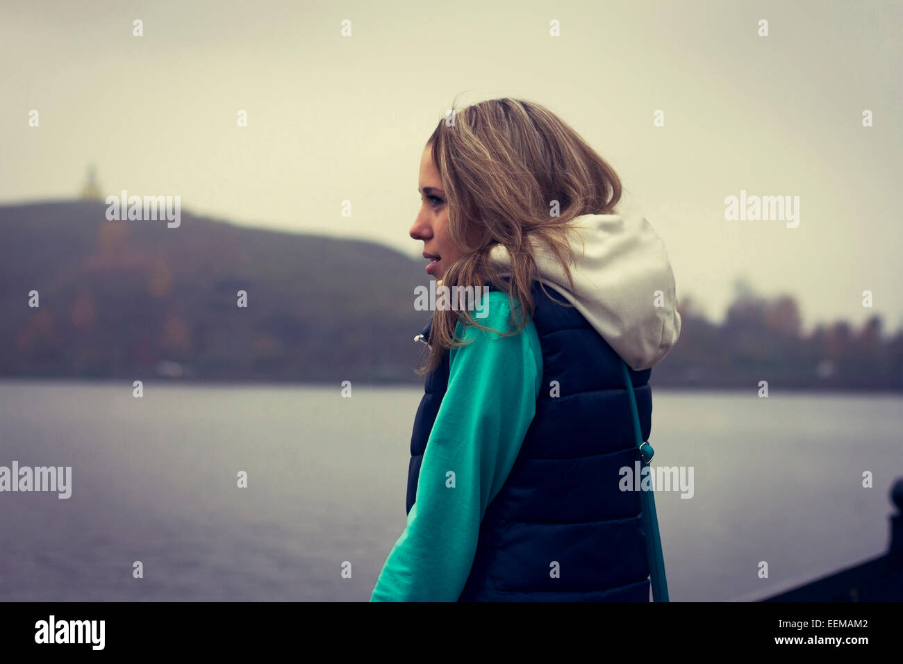 Caucasian woman admiring scenic lake view Stock Photo