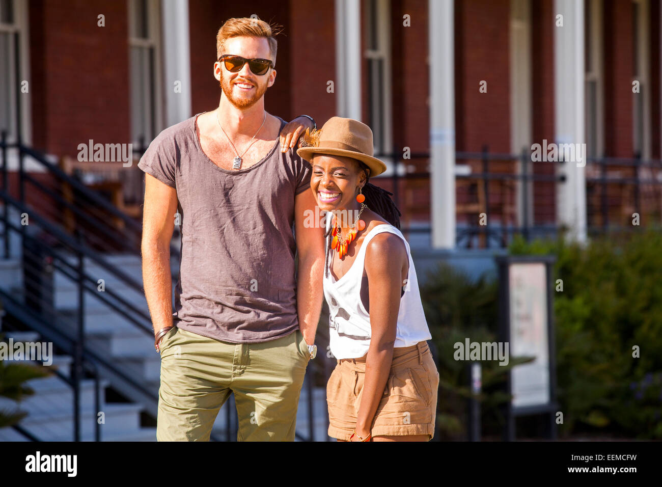 Laughing couple walking outdoors Stock Photo