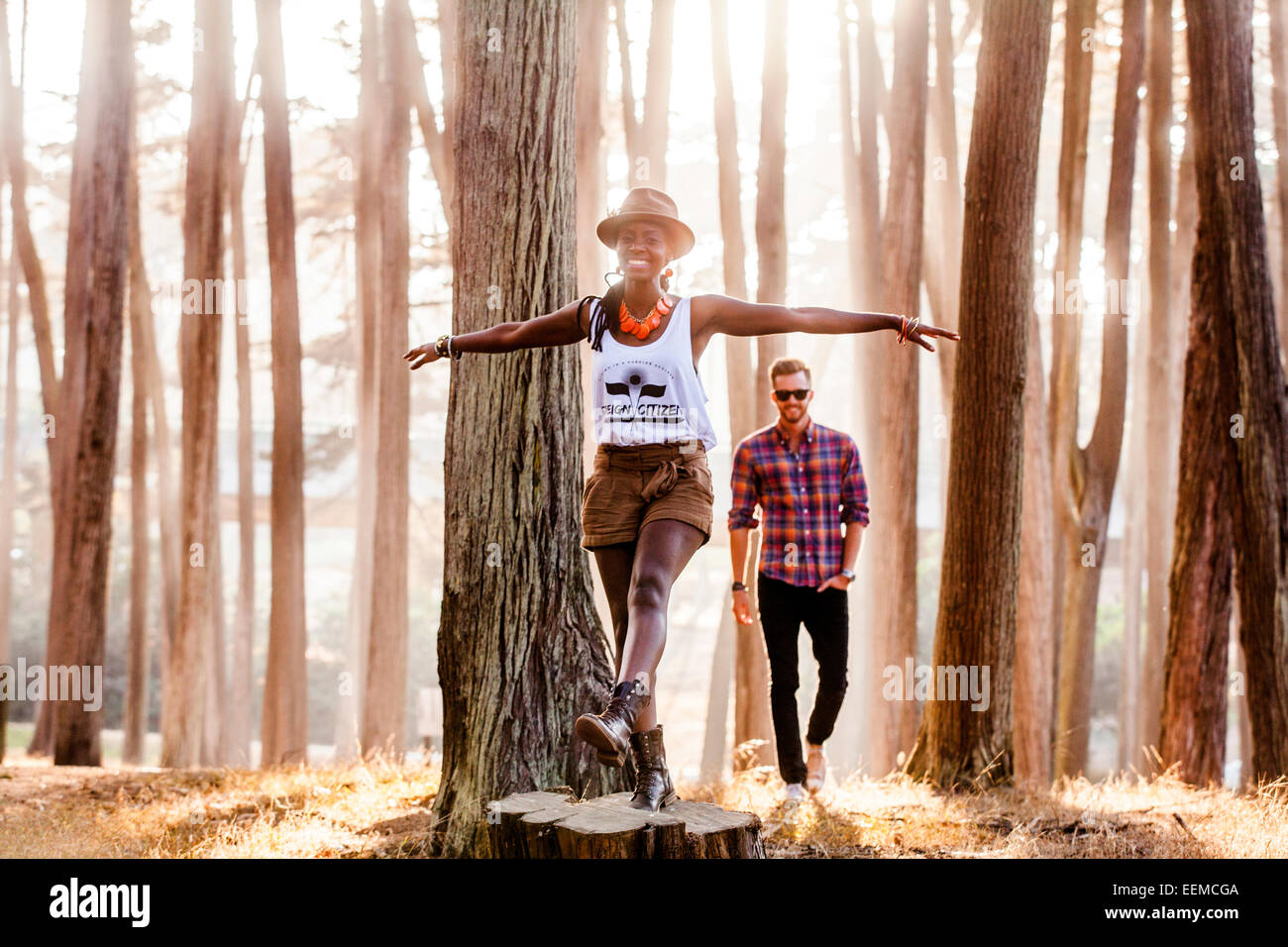 Couple exploring sunny forest Stock Photo