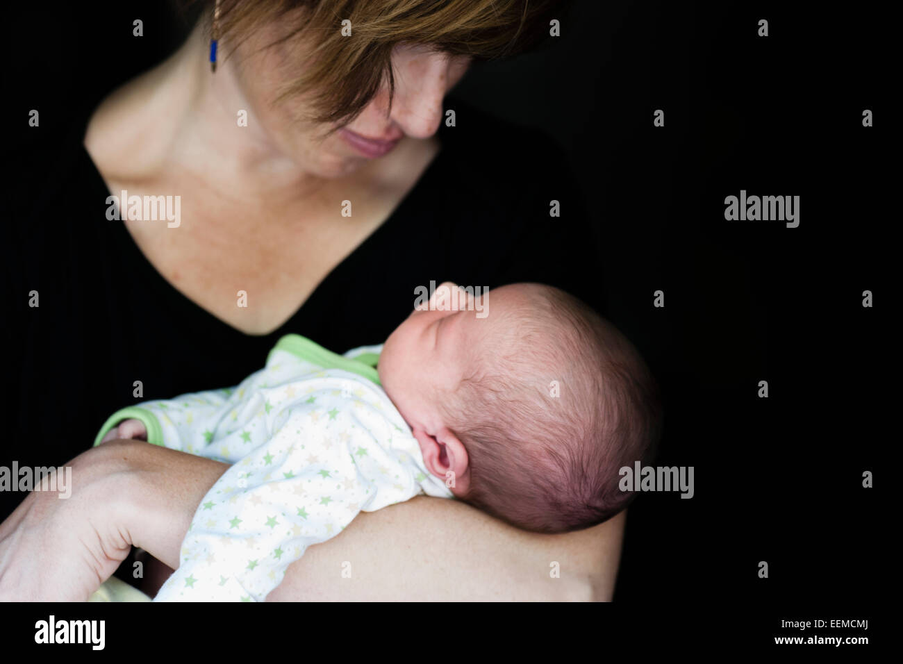 Close up of mother holding newborn baby Stock Photo