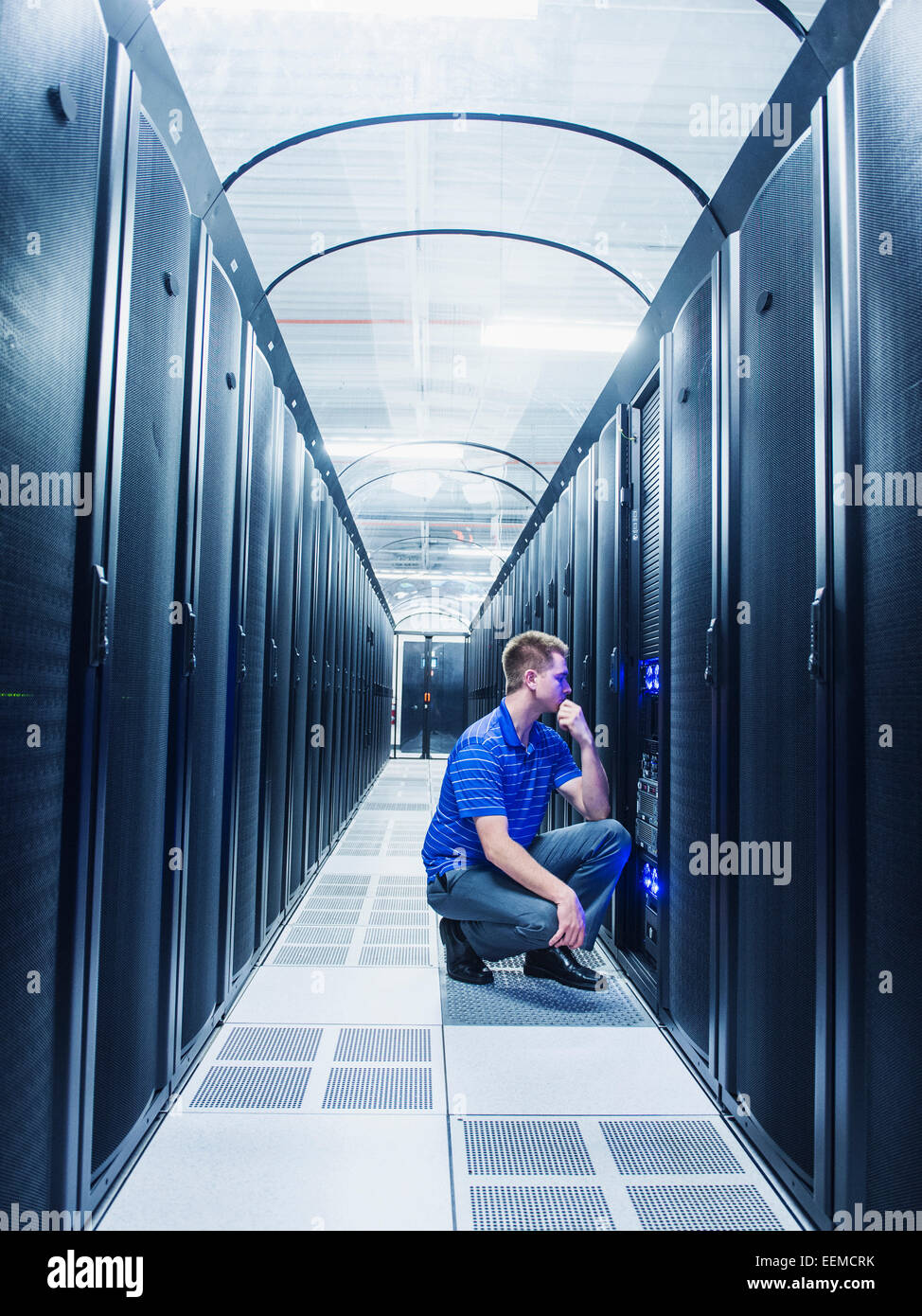 Caucasian businessman working in server room Stock Photo Alamy