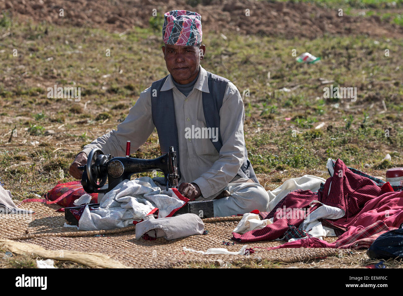 Nepalese tailor with sewing machine in the country, at Nargakot, Nepal Stock Photo