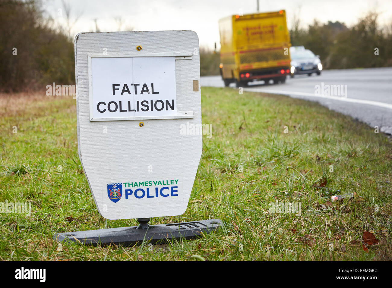 Police signs near the scene of a fatal accident on a rural road Stock Photo