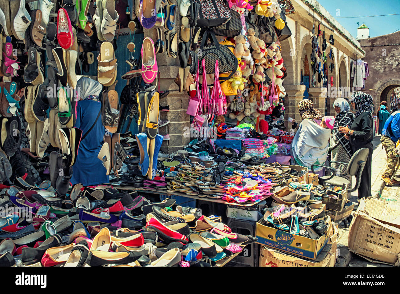 Arab people at a clothes market in Essaouira, Morocco. Stock Photo