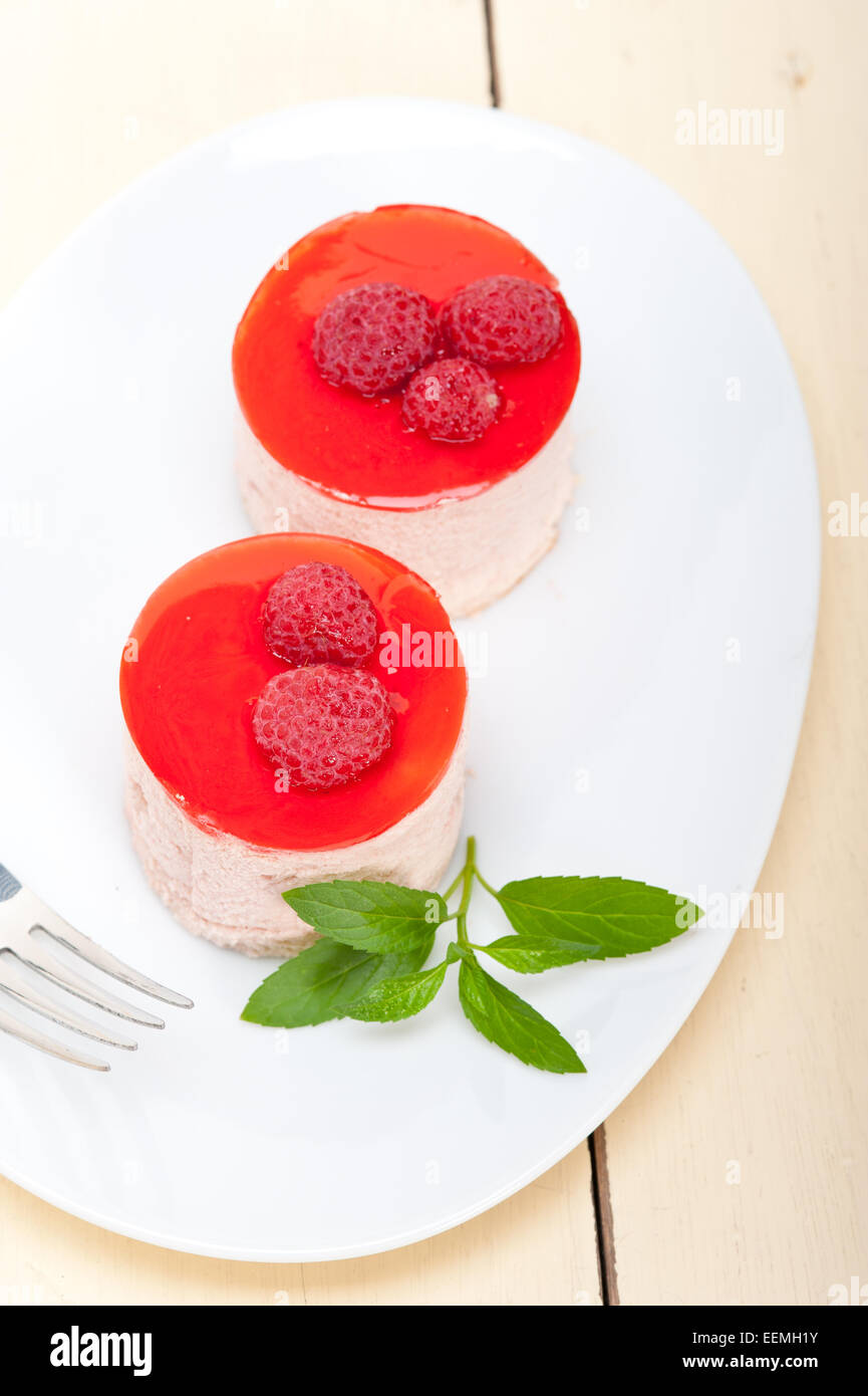 fresh raspberry cake mousse dessert round shape with mint leaves Stock ...