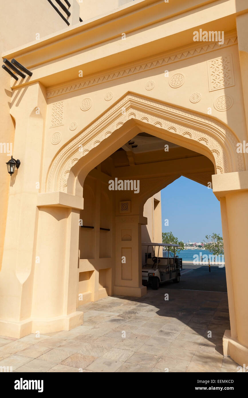 Yellow house facade with classical Arabic style arch Stock Photo