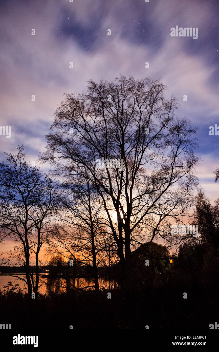 Night landscape and cloudy starry sky Stock Photo - Alamy