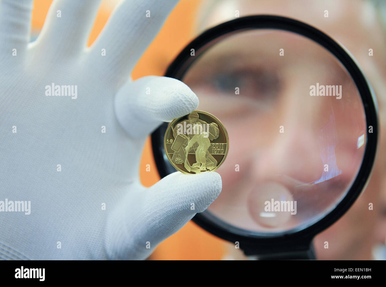 Buffalo Sabre goaltender Dominik Hasek coins his own gold half-ounce medal, commemorating his induct to The Hockey Hall of Fame in Toronto last year, in Jablonec nad Nisou Mint, Czech Republic, on Tuesday, January 20, 2015. (CTK Photo/Radek Petrasek) Stock Photo