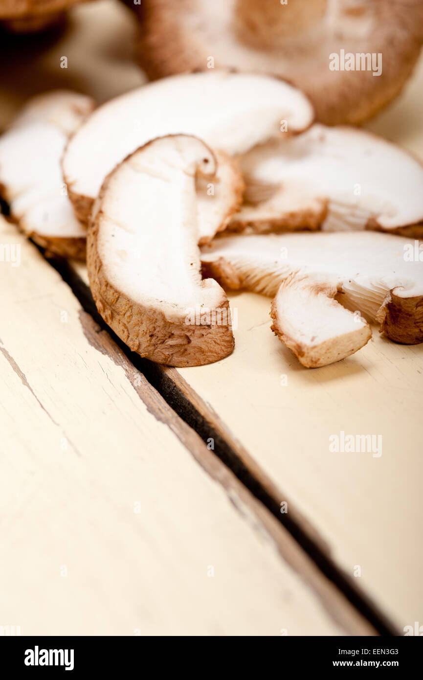 fresh shiitake mushrooms on a rustic wood table Stock Photo - Alamy