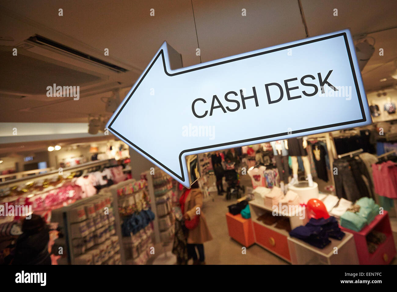 Cash desk sign in a H&M store Stock Photo - Alamy