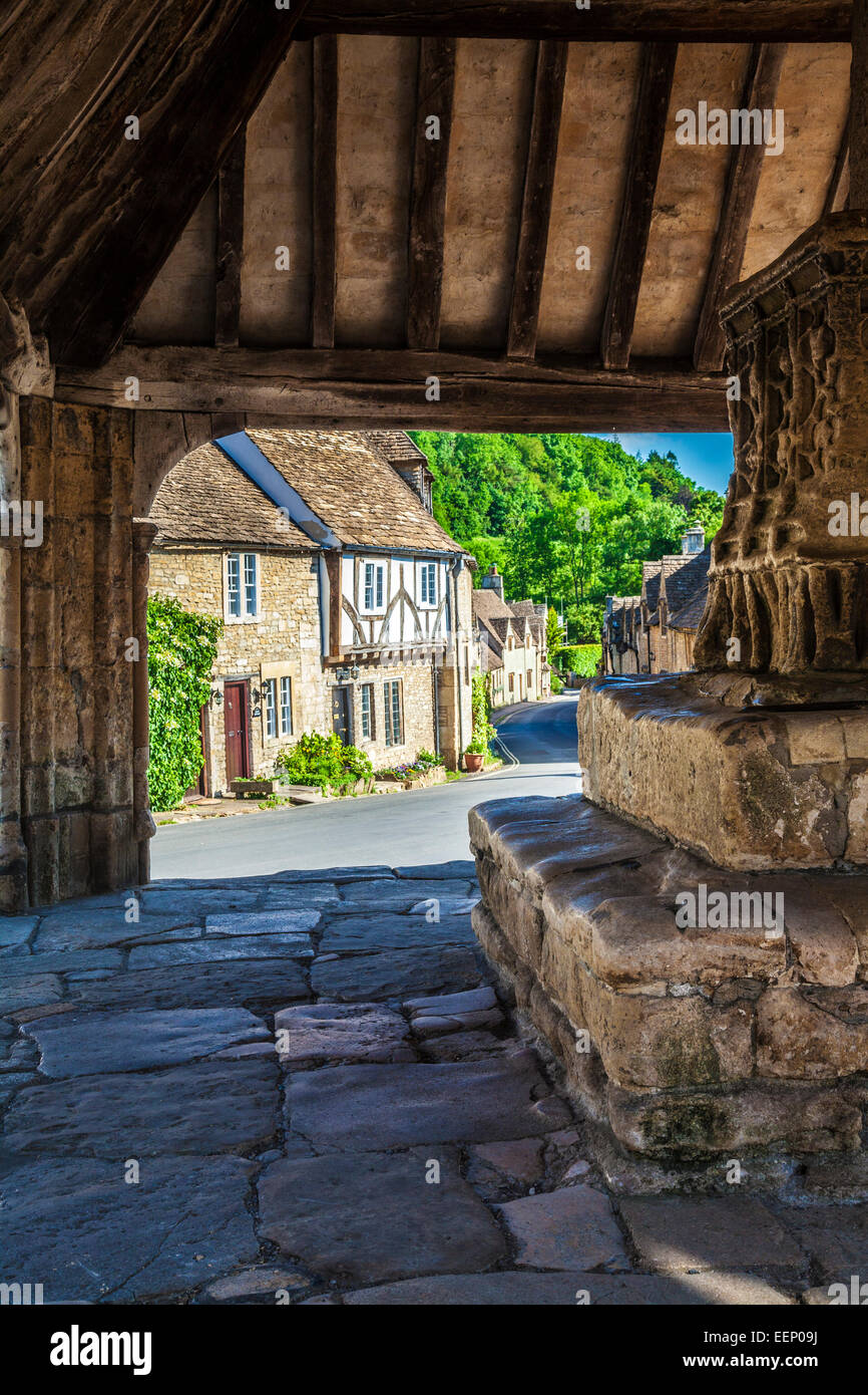 View through the medieval market cross in the Cotswold village of Castle Combe in Wiltshire. Stock Photo