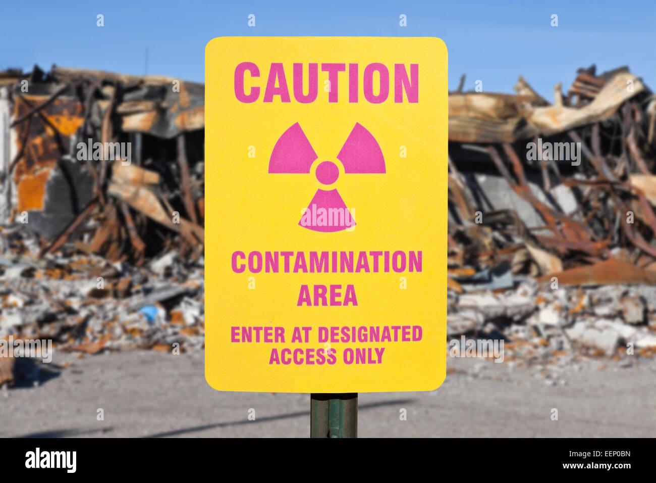 Contamination area warning sign with ruin background. Stock Photo