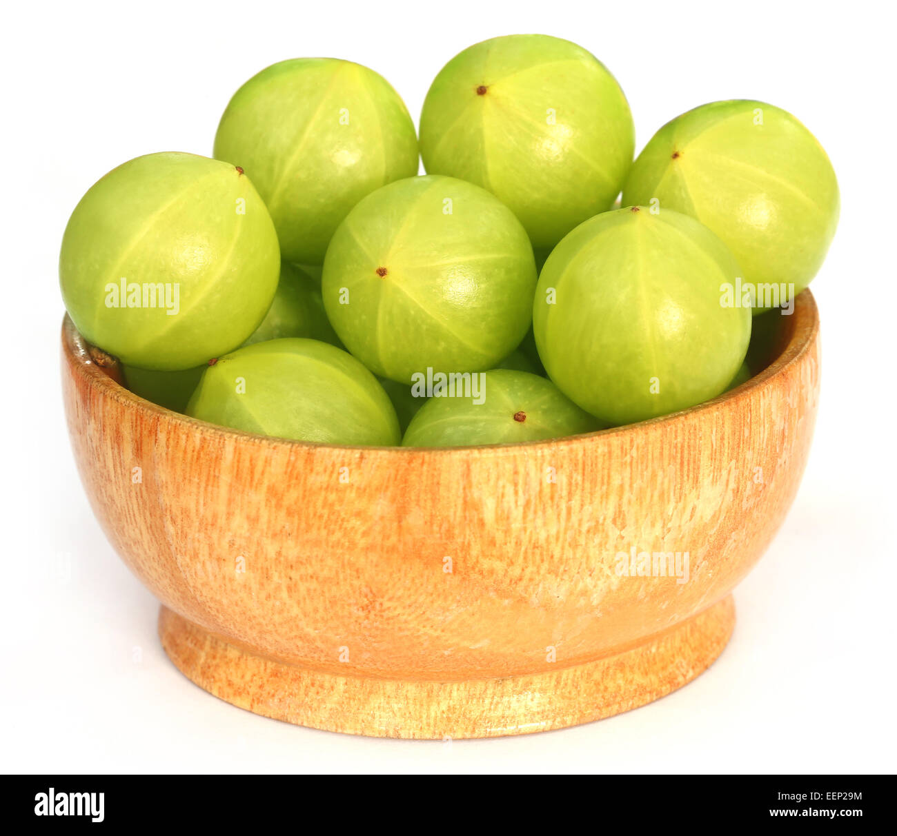 Amla fruits in a bowl over white background Stock Photo