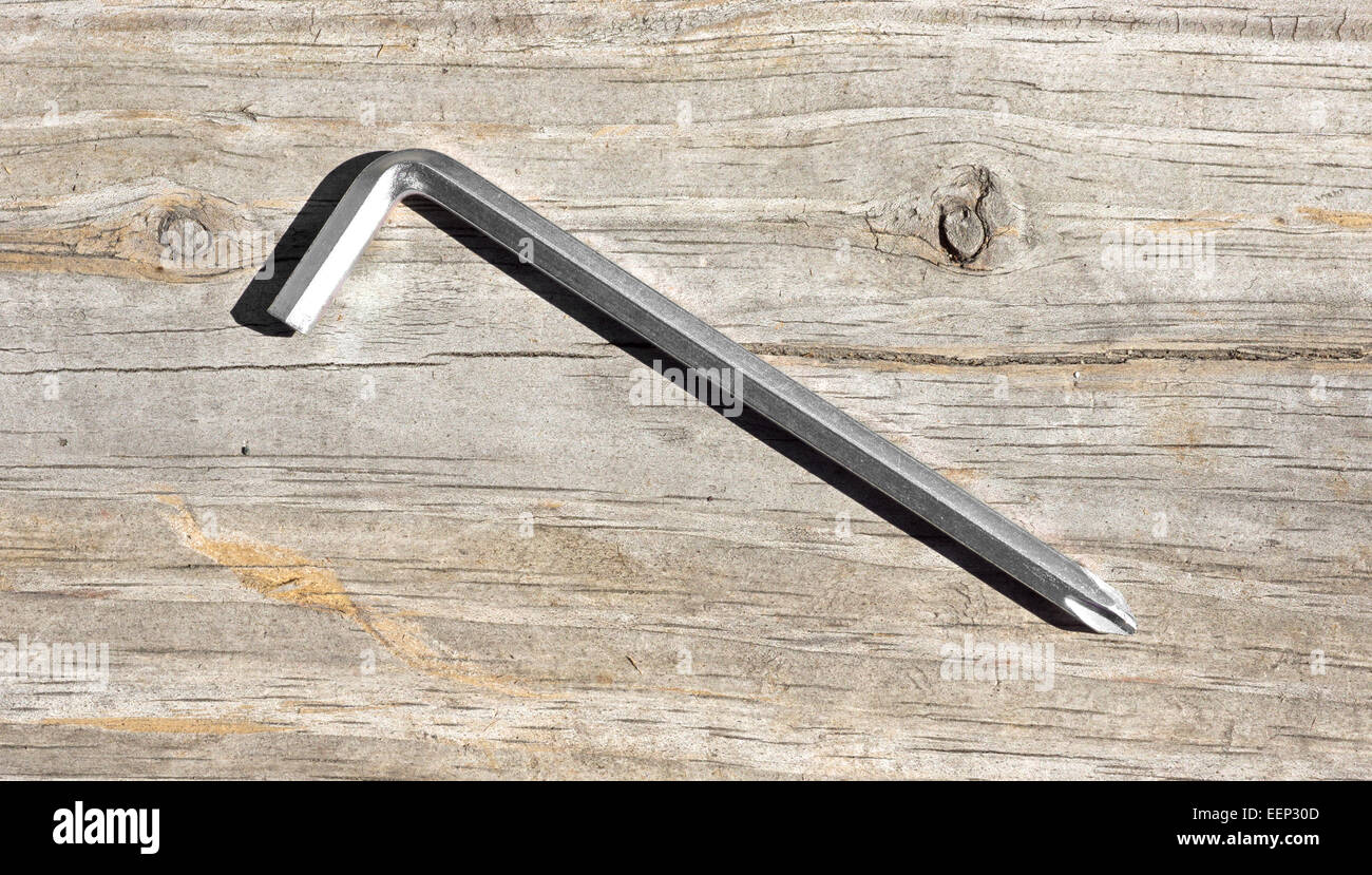 A single purpose phillips screwdriver with an acute hexagon end for