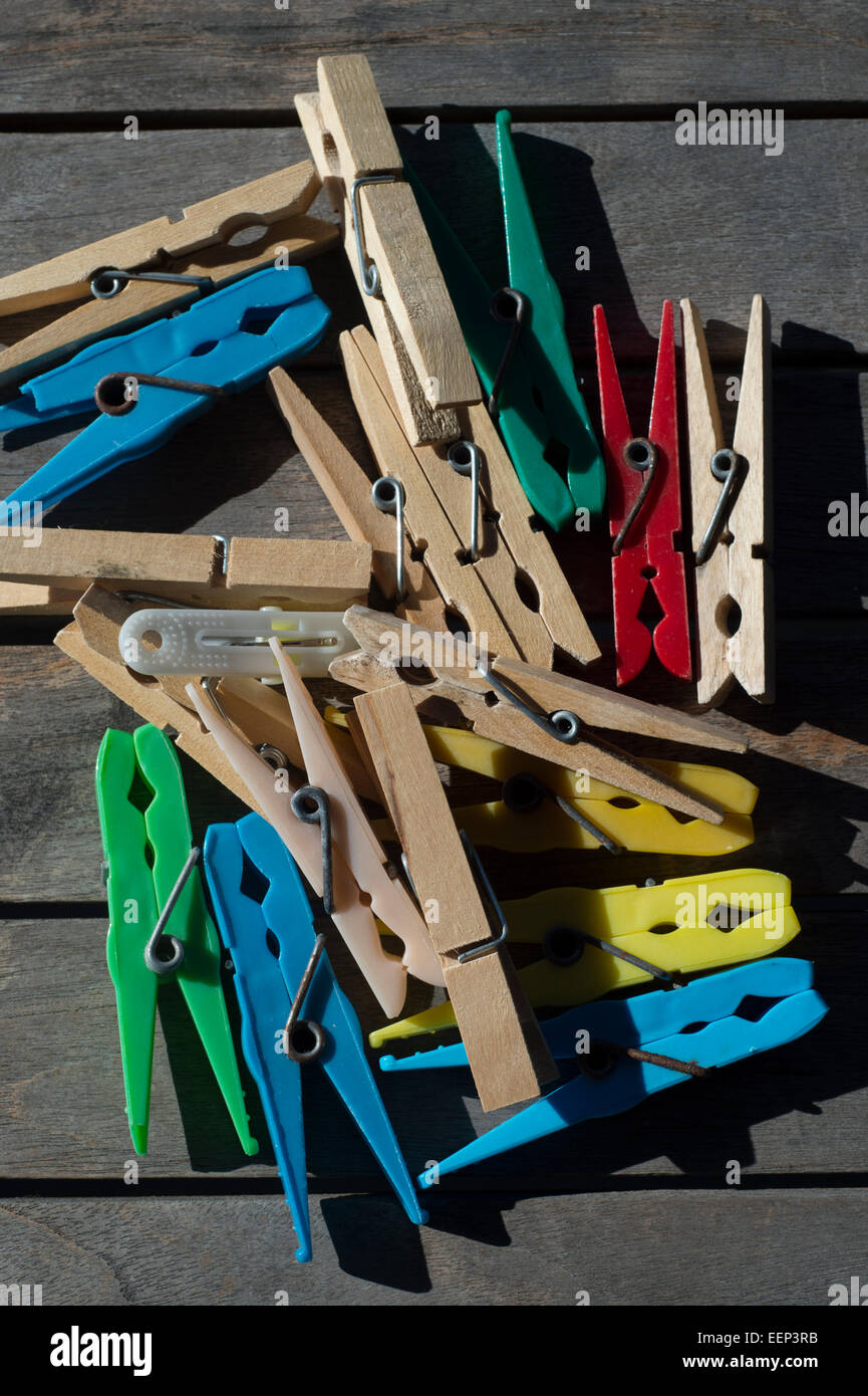 pile of wooden and plastic clothes pegs Stock Photo