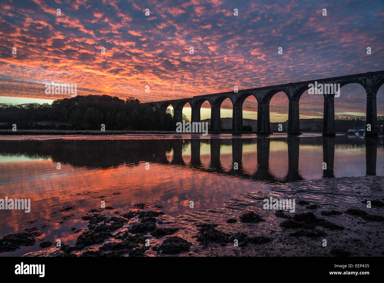 Sunrise on the river lynher with beautiful sky and the viaduct with reflections at st germans, cornwall, uk Stock Photo