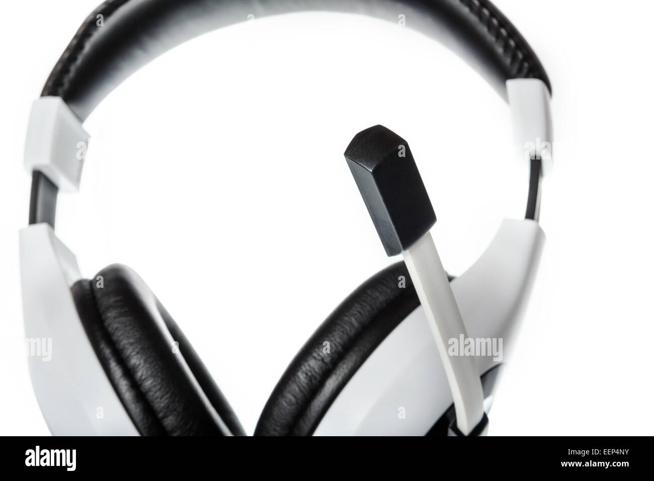 Black and white pc or computer headphones with focus on microphone side ...