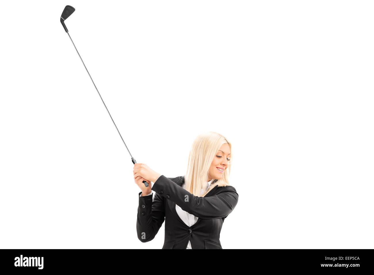 Businesswoman swinging a golf club isolated on white background Stock Photo