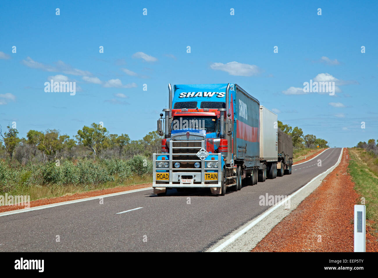 Australian freight transport by triple road train fitted with roo bar on the Stewart Highway, Northern Territory, Australia Stock Photo