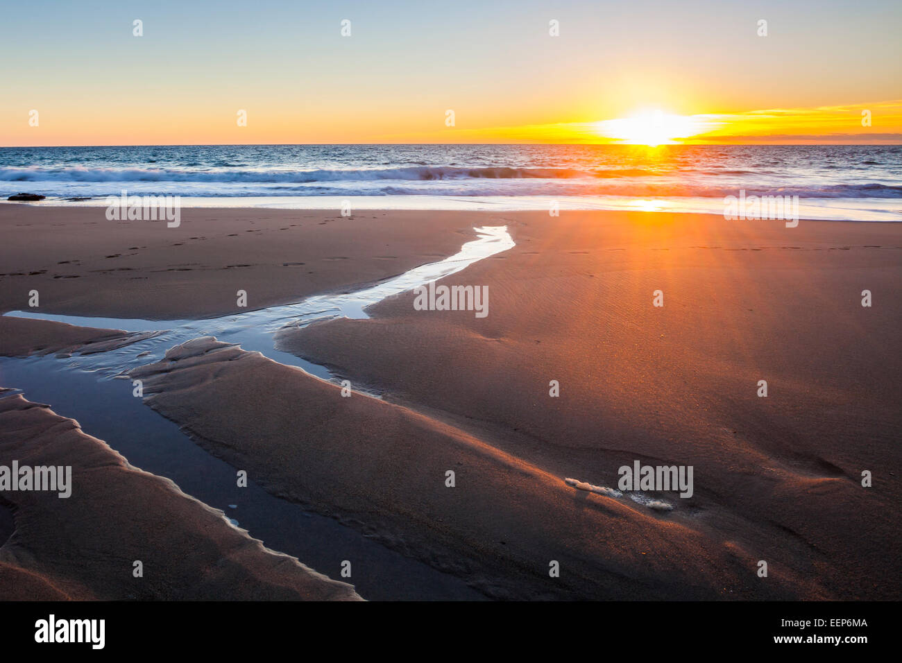 Beautiful sunset on Porthcew beach at Rinsey Cove Cornwall England UK Europe Stock Photo