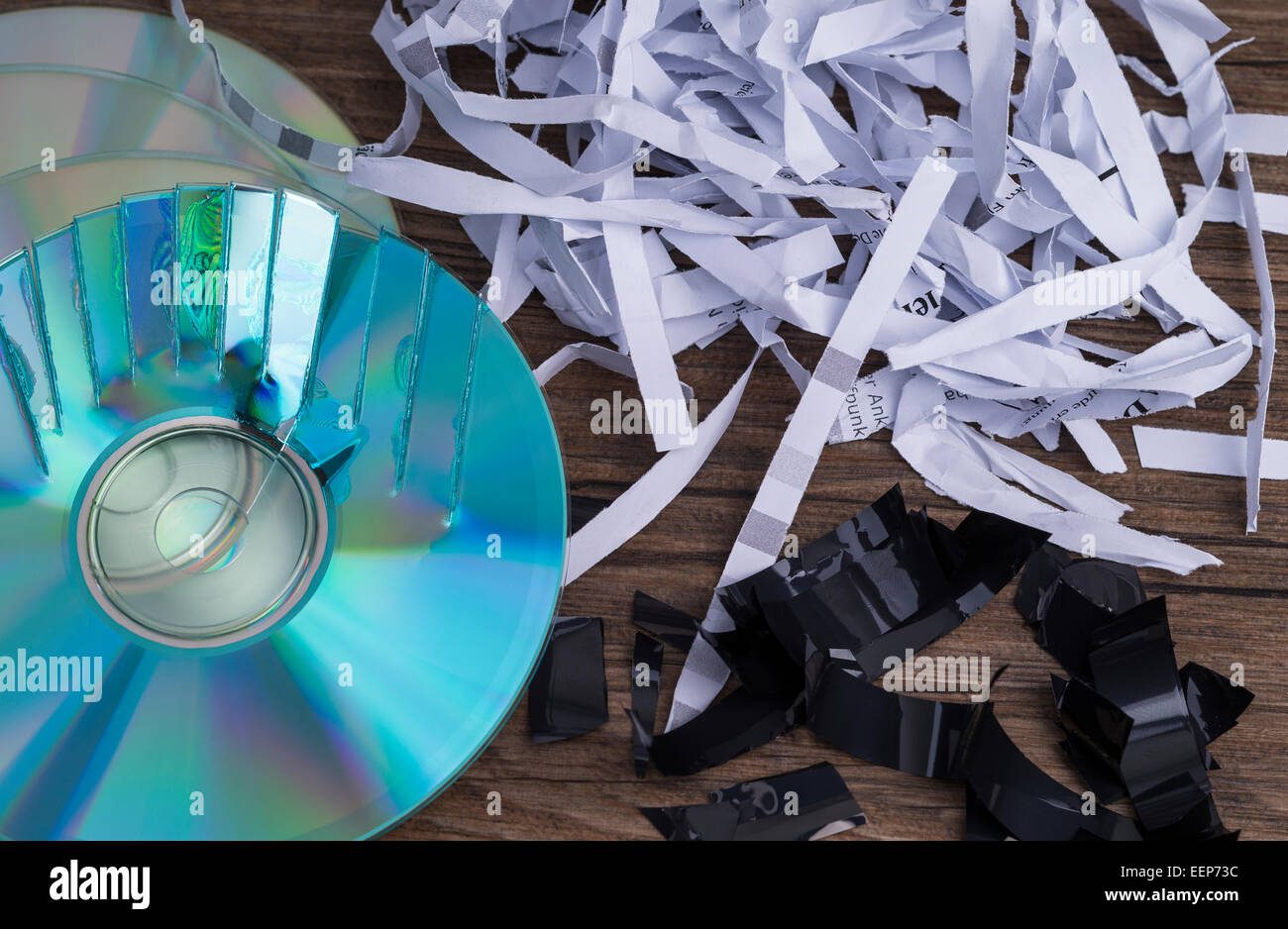Image shows paper shavings, tape shred and some compact disks Stock Photo