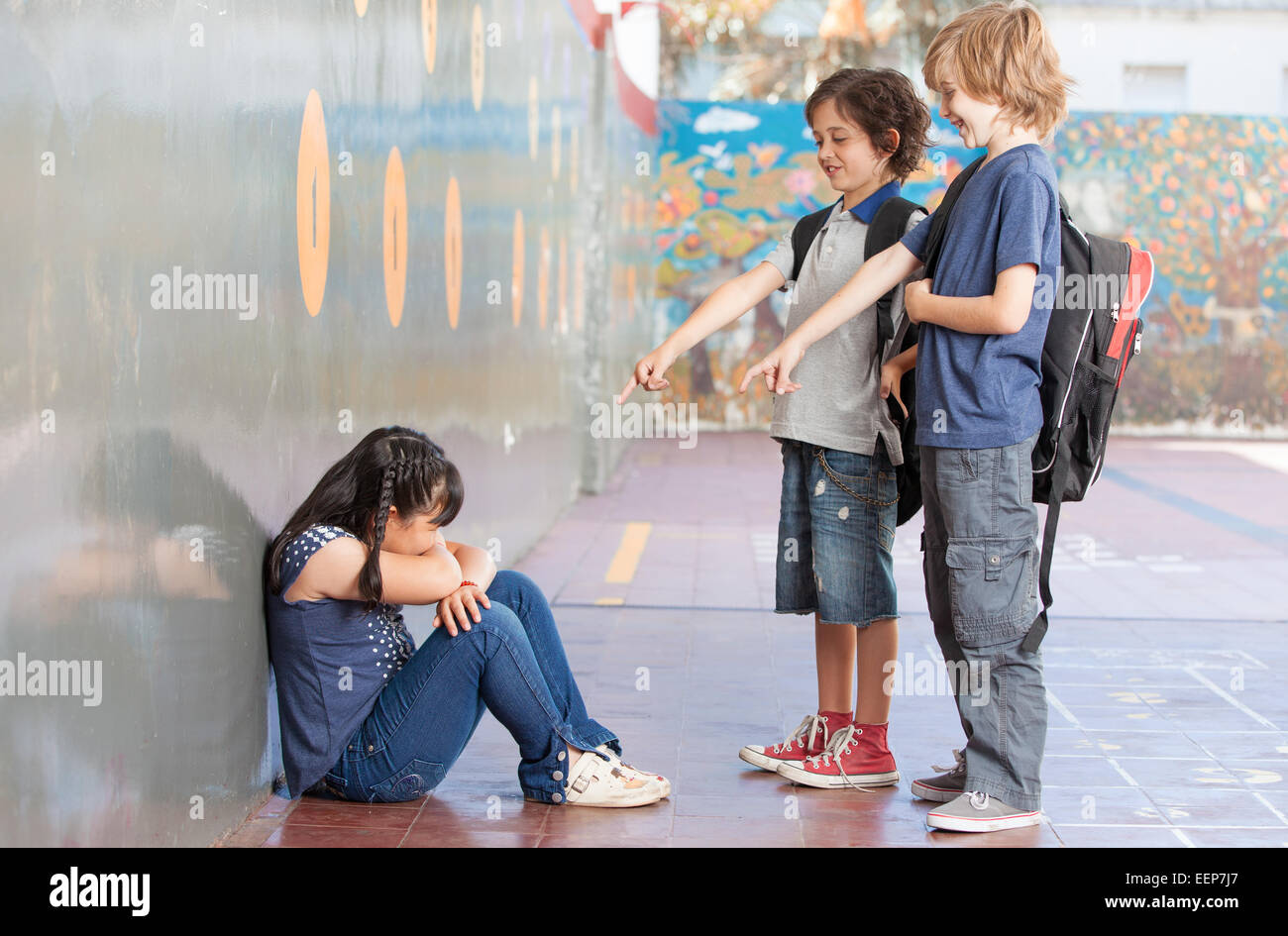 Elementary Age Bullying in Schoolyard. Stock Photo