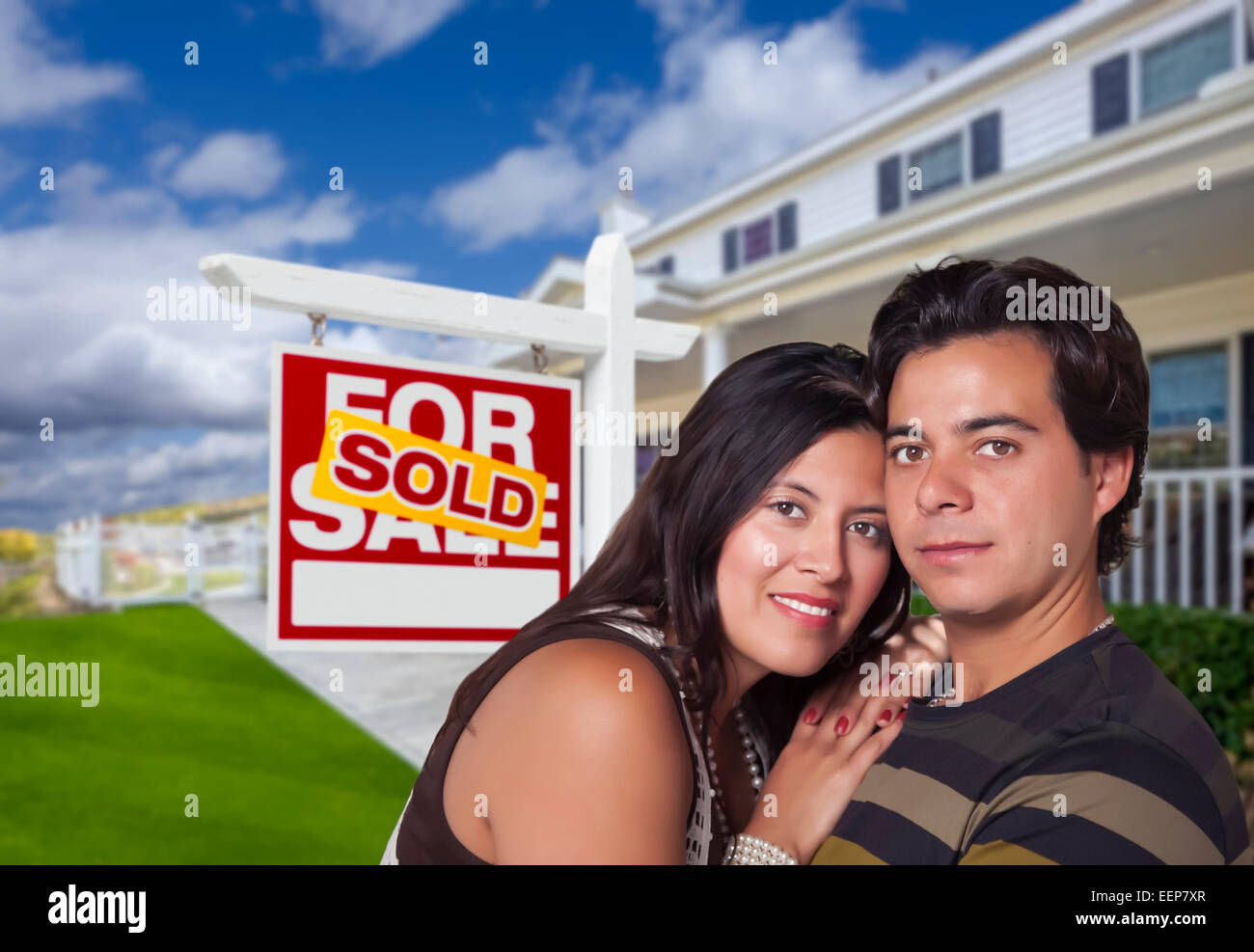 Young Happy Hispanic Couple in Front of Their New Home and Sold For ...