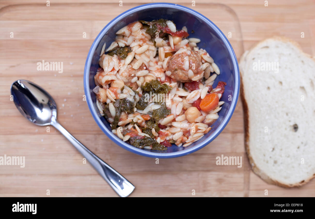 Chicken Meatball Soup with Kale, Chickpeas & Orzo Stock Photo