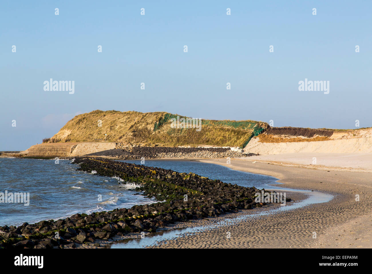 Coastal protection project on the west shore of North sea island Spiekeroog, Germany, to protect the dunes and beach from waves Stock Photo