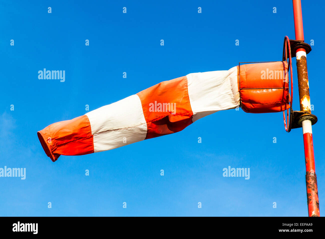 Windsock, on a rusty pole, for the determination of wind direction and